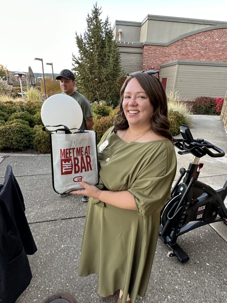 Haley Palmer with WIN Home Inspections, one of the lucky winners at CycleBar Bend